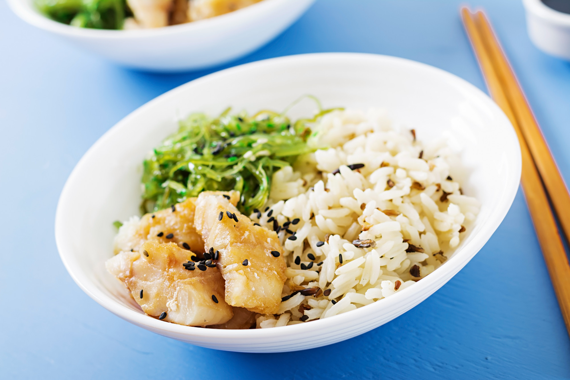 Coconut rice bowl with aubergine, sweet potato, corn and greens